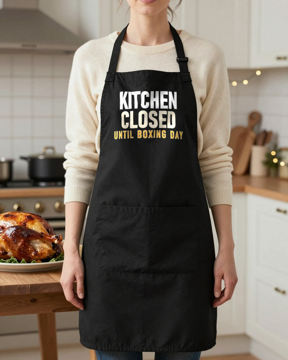 Kitchen Closed Until Boxing Day Christmas apron in Black, worn, our photo