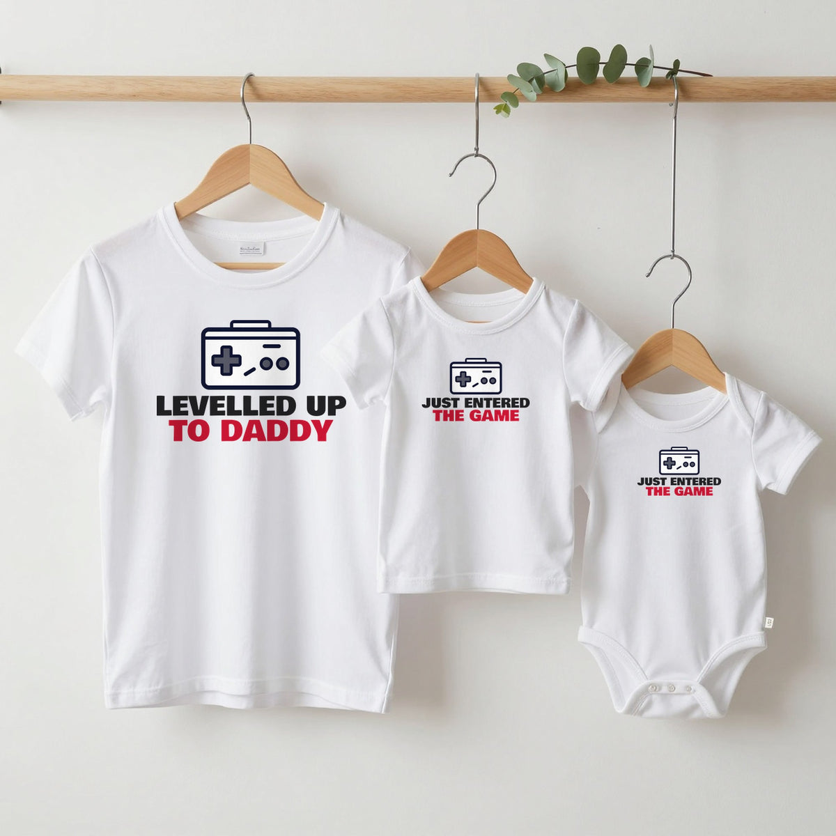 Levelled Up To Daddy & Just Entered The Game matching set grown-up tee, kids tee and baby grow on hangers