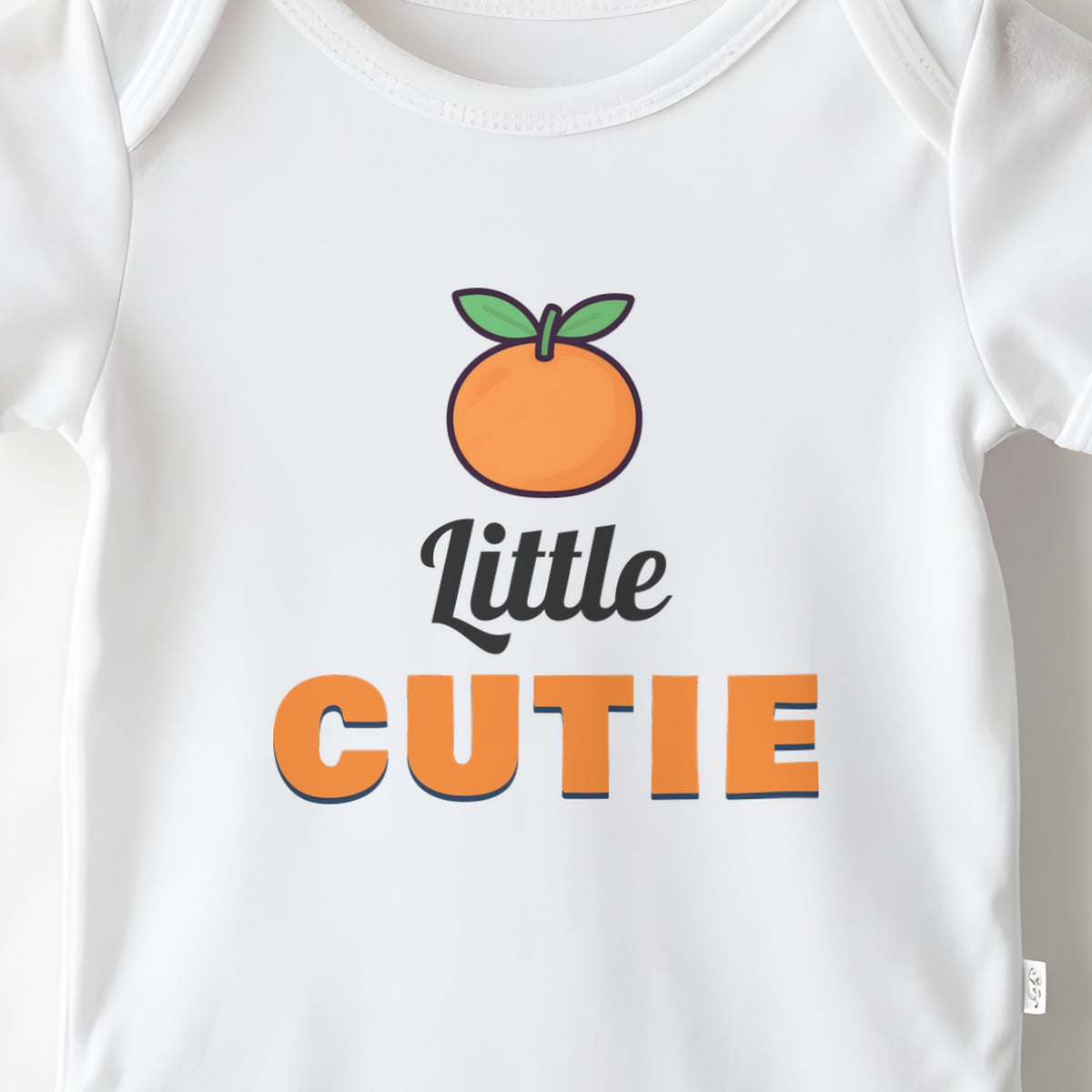 Little Cutie baby grow print close-up