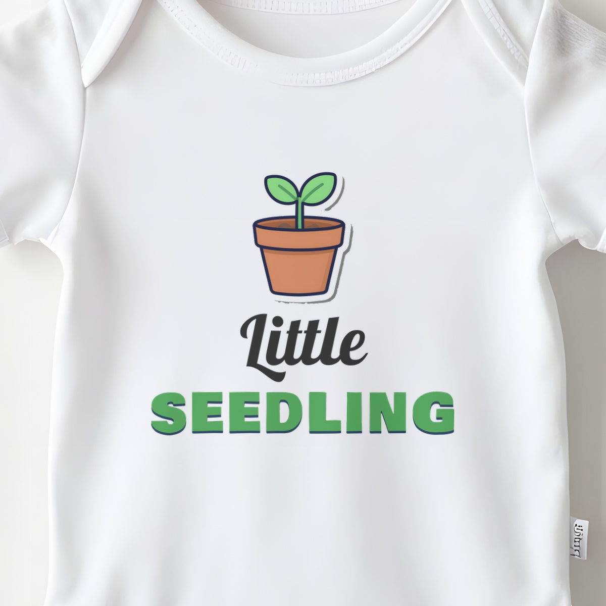 Little Seedling baby grow print close-up