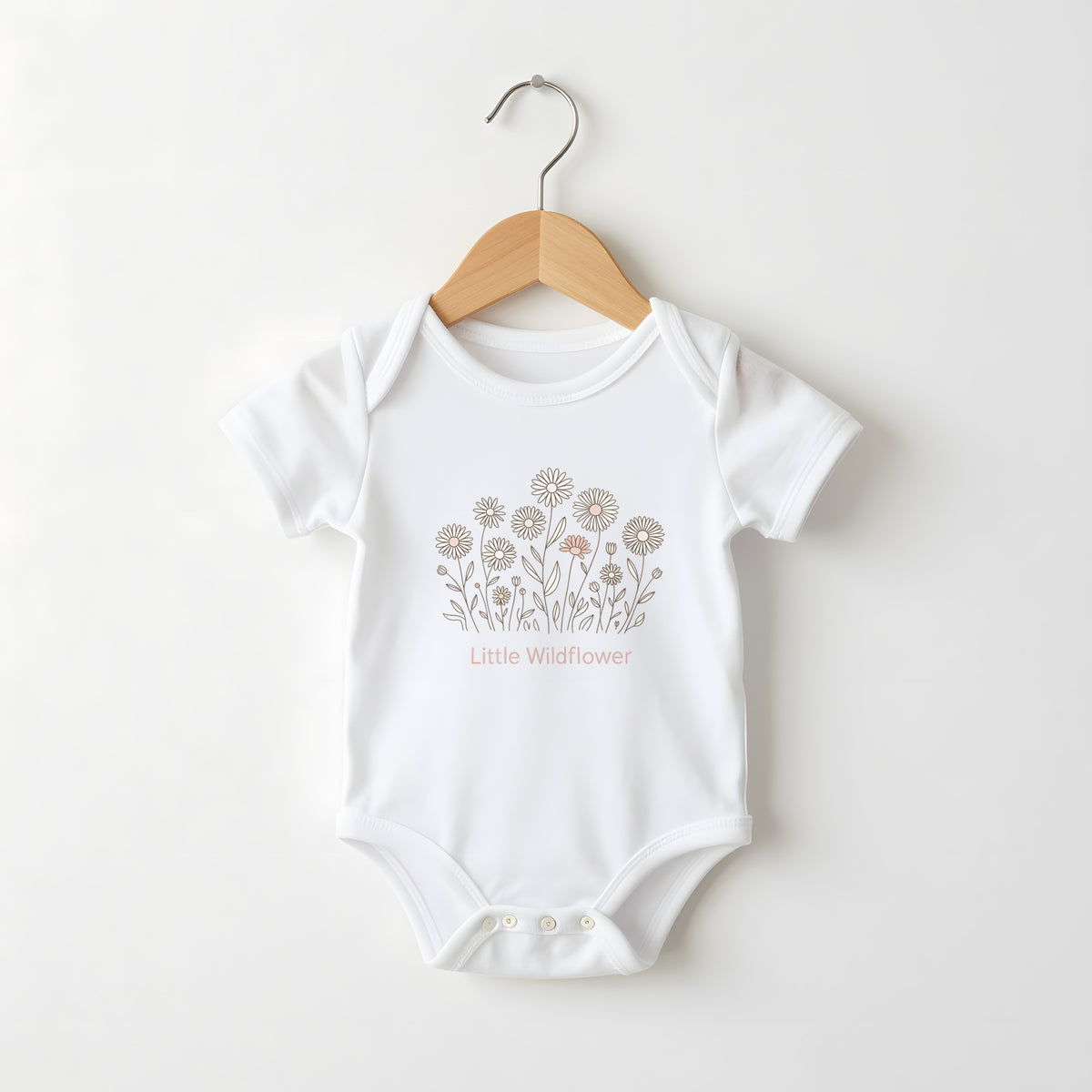 Little Wildflower white baby grow on a hanger