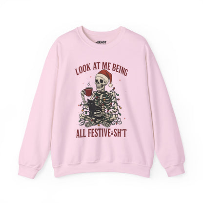 light pink sweatshirt with funny skeleton christmas graphic