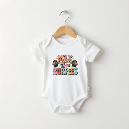 Milk Then Burpees white baby grow on a hanger