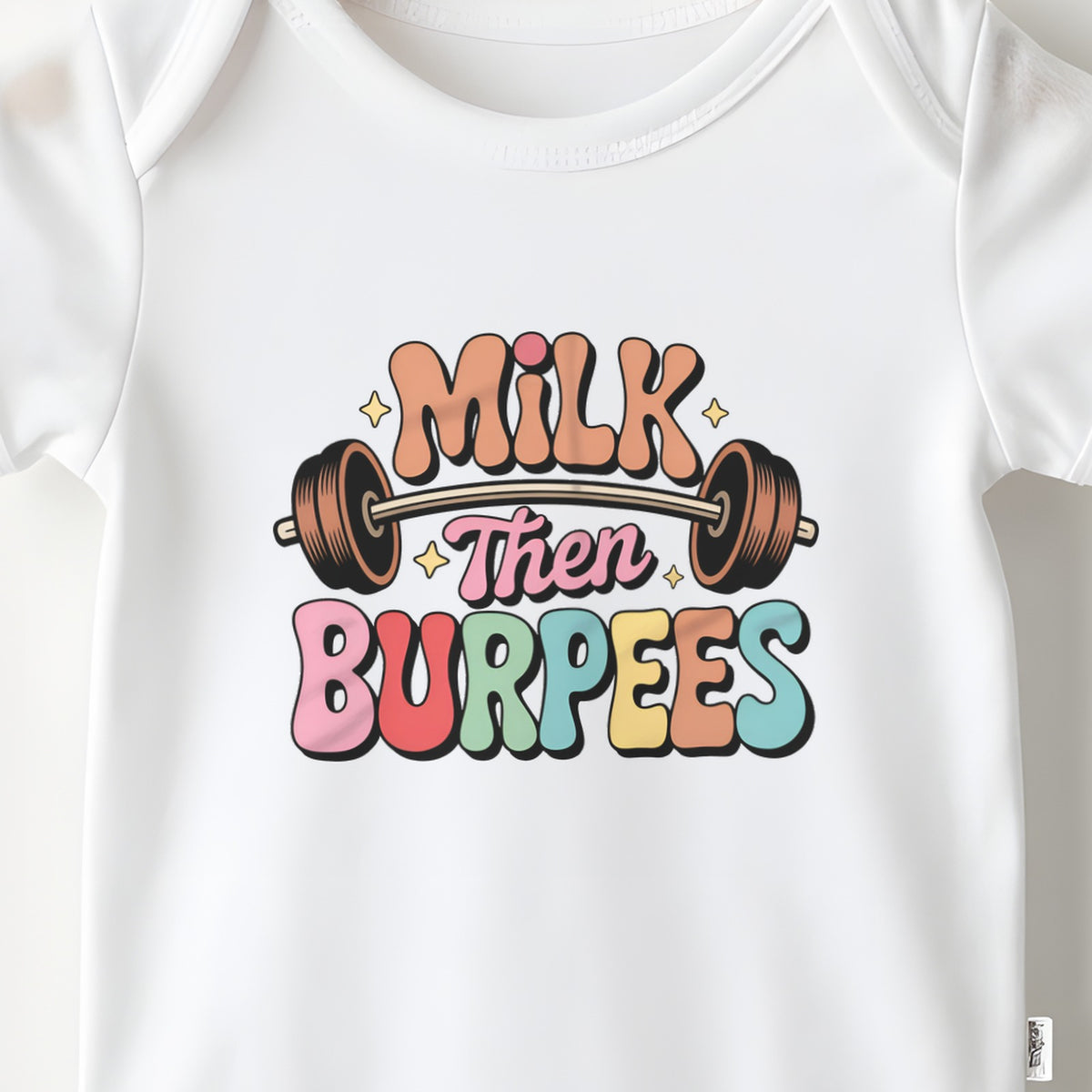 Milk Then Burpees baby grow print close-up