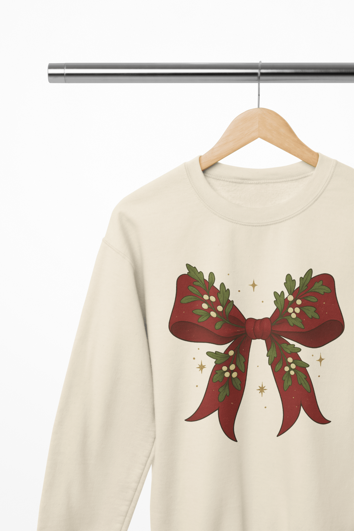 beige sweatshirt with mistletoe bow festive graphic