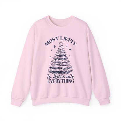 white sweatshirt with most likely to decorate everything holiday saying