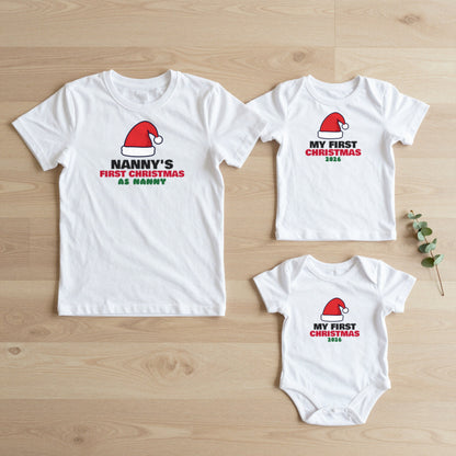 Nanny's First Christmas & My First Christmas matching set flat lay on oak floor: grown-up tee, kids tee and baby grow