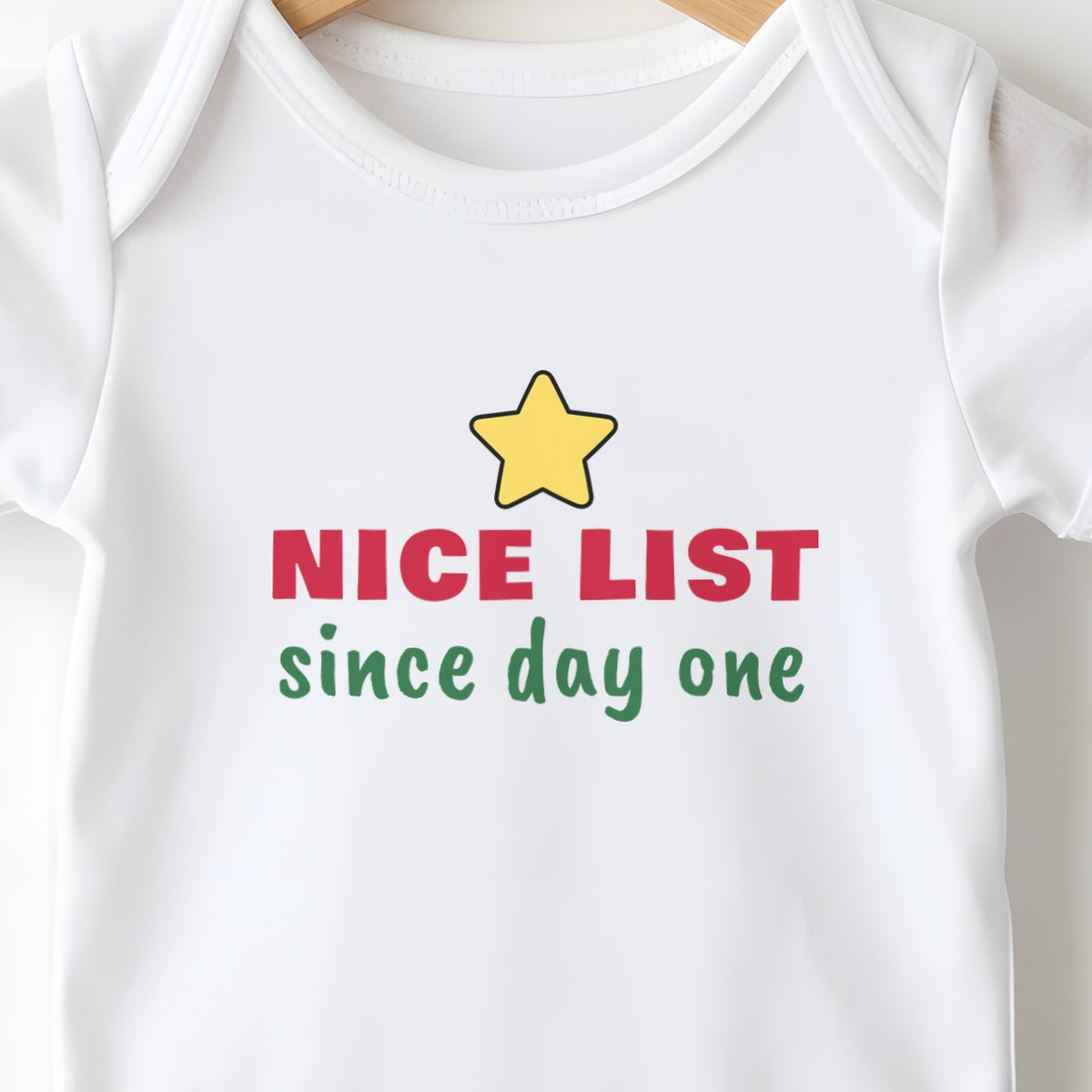 Nice List Since Day One baby grow print close-up