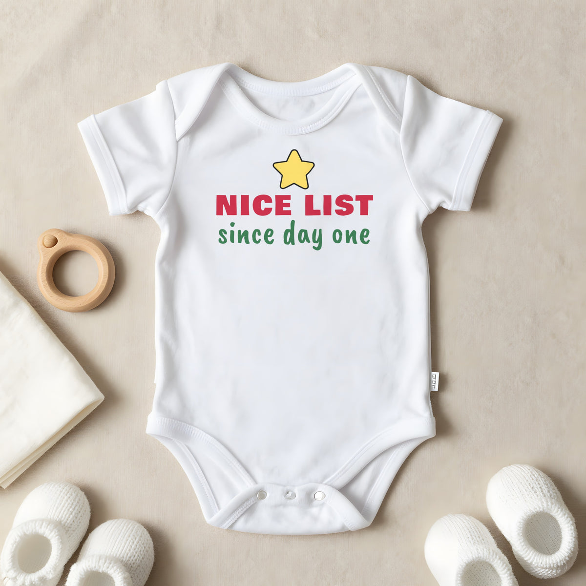 Nice List Since Day One baby grow laid flat
