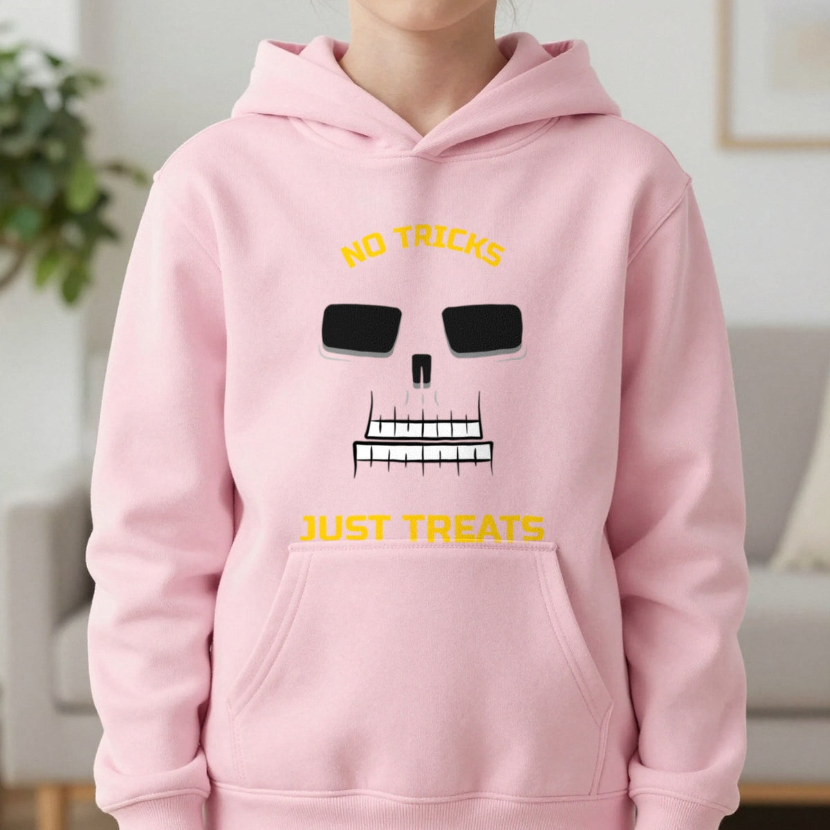 No Tricks Just Treats Skeleton Halloween Kids Hoodie in Light Pink, worn, our photo