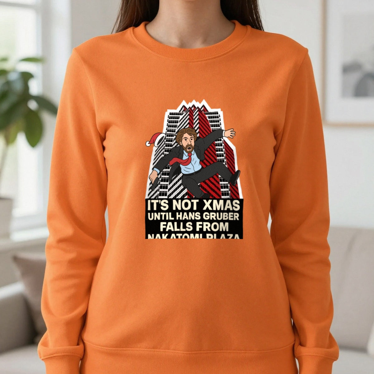 Not Xmas Until He Falls From The Plaza Christmas T-Shirt & Sweatshirt in Orange, worn, our photo