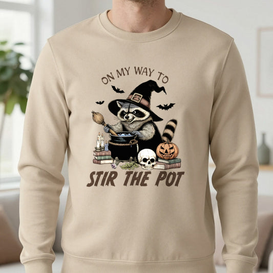 On My Way To Stir The Pot Halloween Raccoon Sweatshirt in Sand, worn, our photo