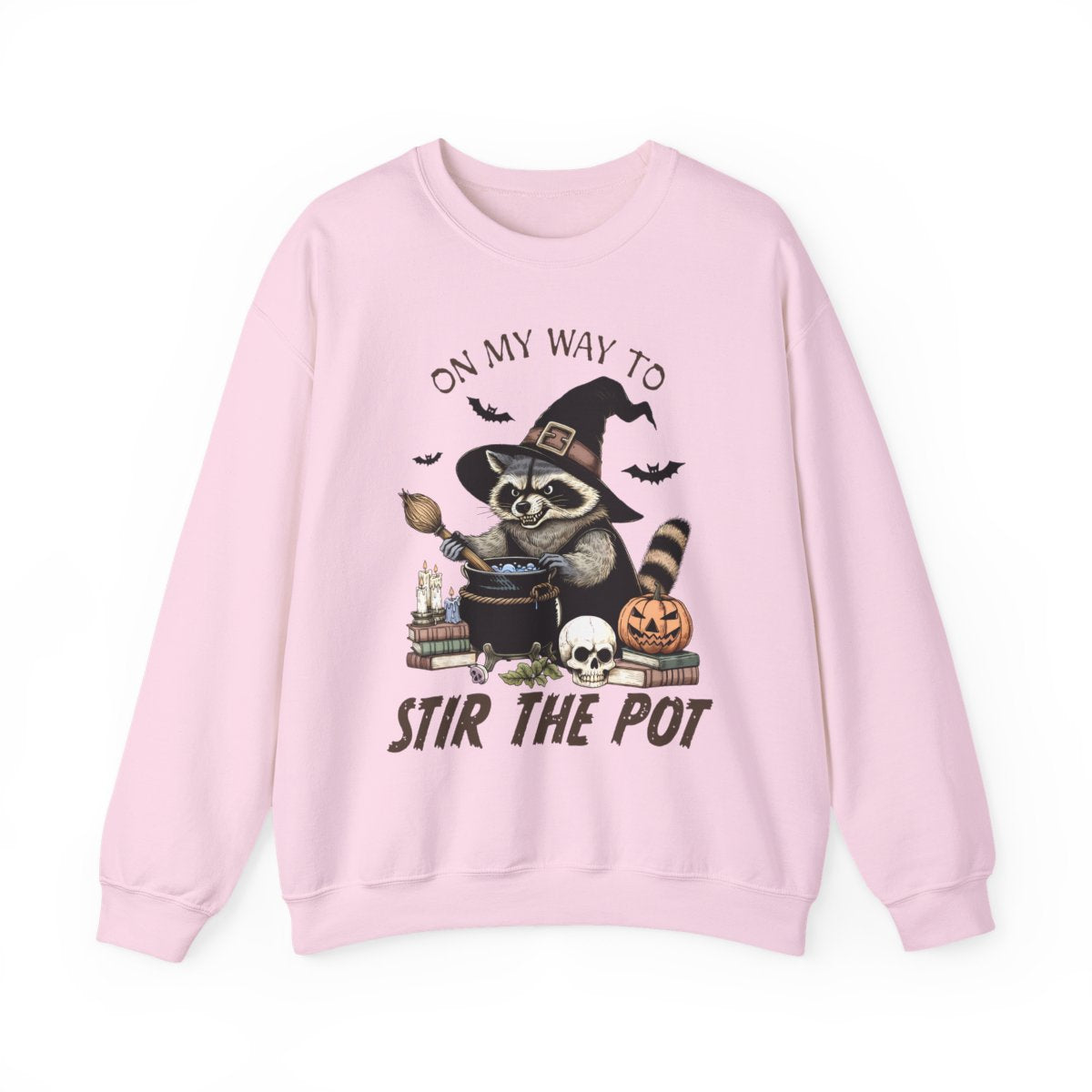 white sweatshirt with witchy raccoon cauldron candles and books spooky design