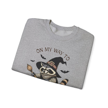 unisex halloween sweatshirt showing raccoon witch front print detail