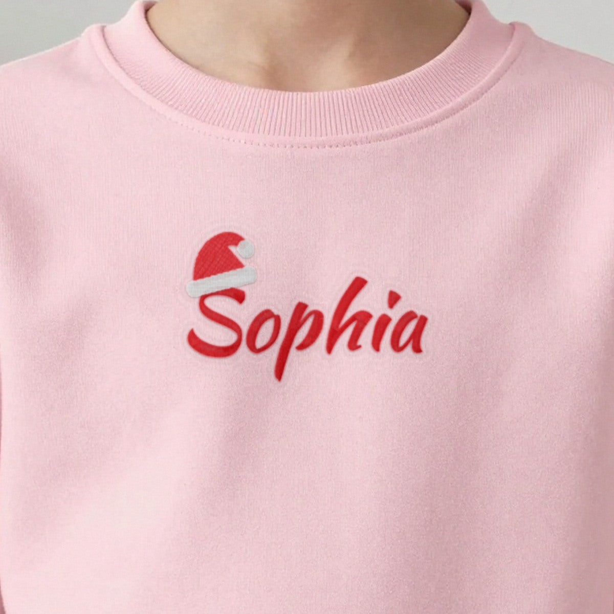 Kids Christmas Jumper with Santa Hat Name, kids sweatshirt in light pink, embroidered