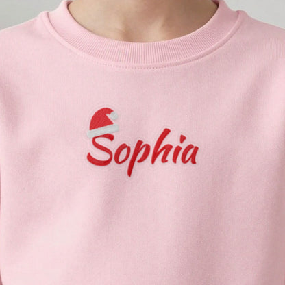 Kids Christmas Jumper with Santa Hat Name, kids sweatshirt in light pink, embroidered