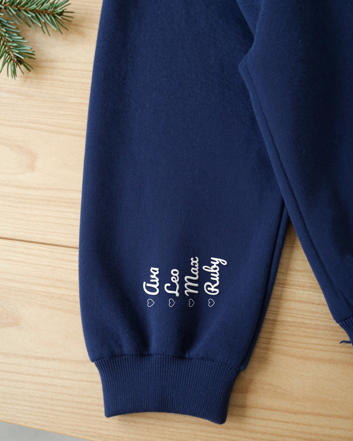 Close-up of grandkids names embroidered on the sleeve above the cuff