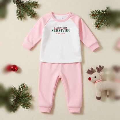 Naughty List Survivor Personalised Matching Family Christmas Pyjamas Set, Baby & Toddler in Pink, our photo