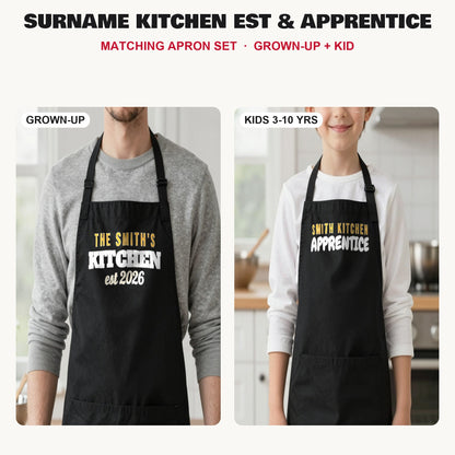Surname Kitchen Est & Apprentice matching apron set in Black: grown-up and kids aprons, our photo