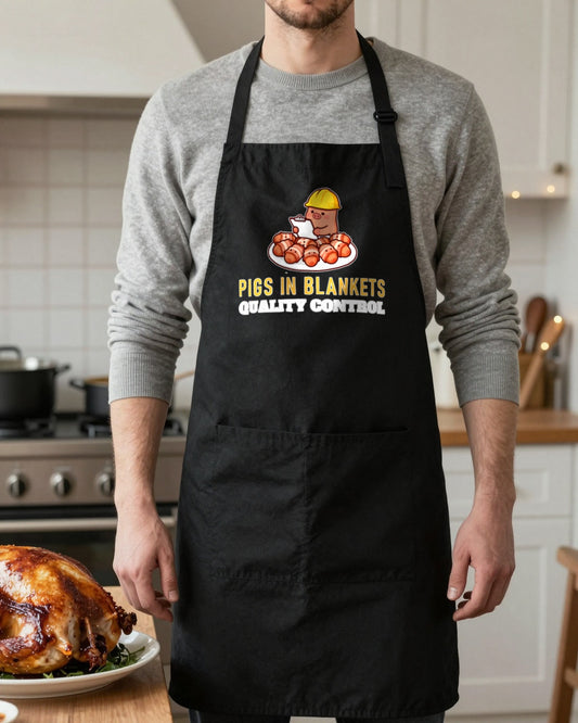 Pigs In Blankets Quality Control Christmas apron in Black, worn, our photo