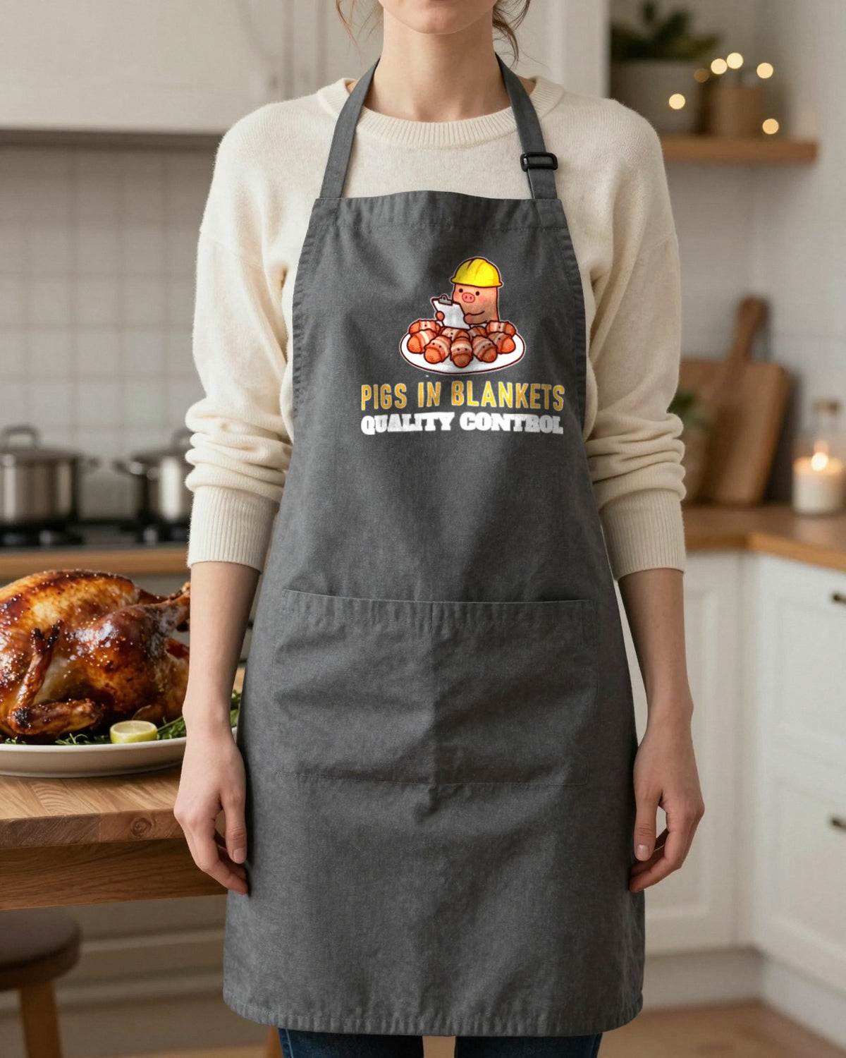Pigs In Blankets Quality Control Christmas apron in Dark Grey, worn, our photo