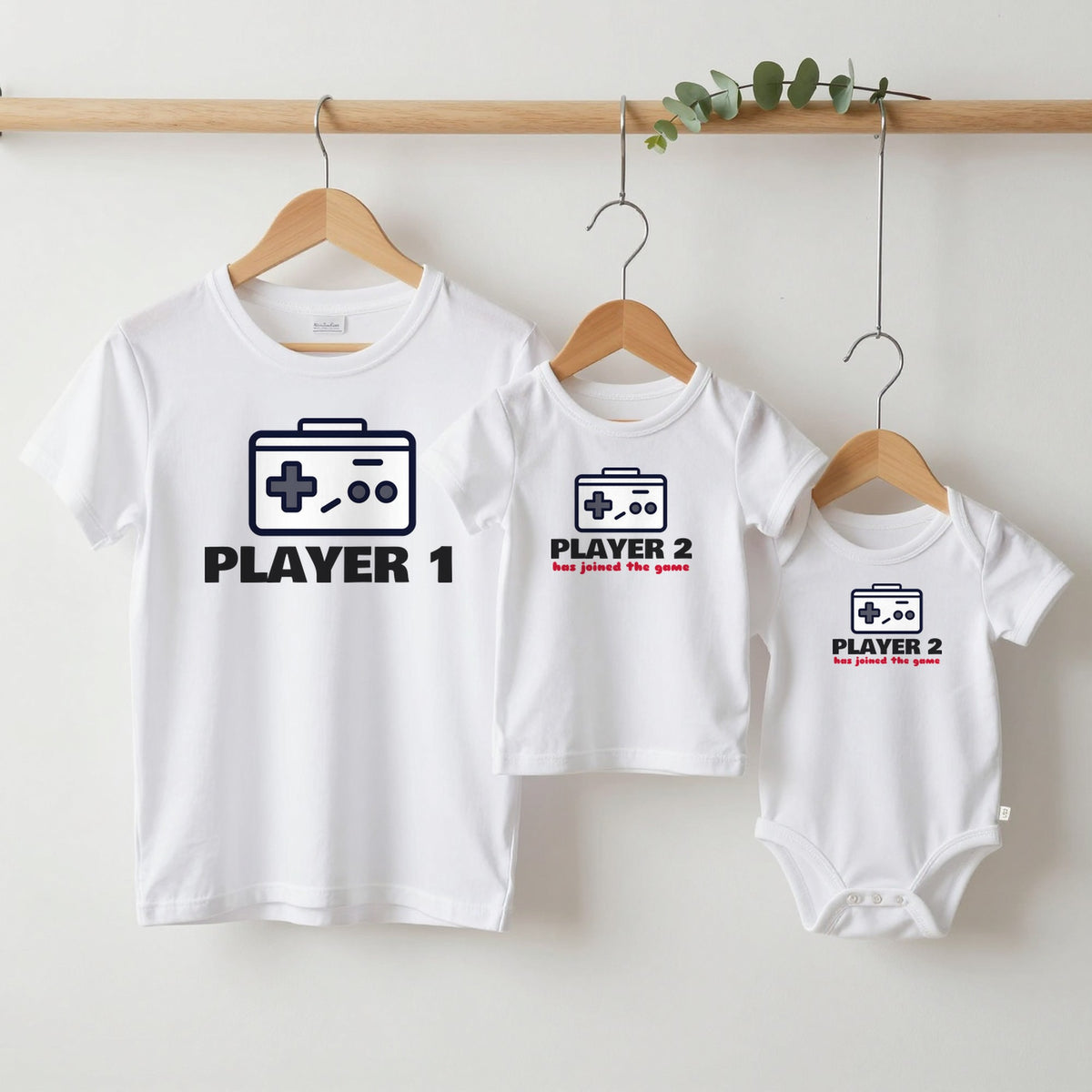Player 1 & Player 2 grown-up tee, kids tee and baby grow on hangers