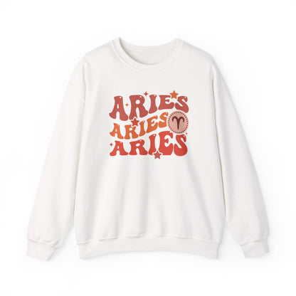 white sweatshirt displaying retro aries sign with groovy lettering and celestial elements