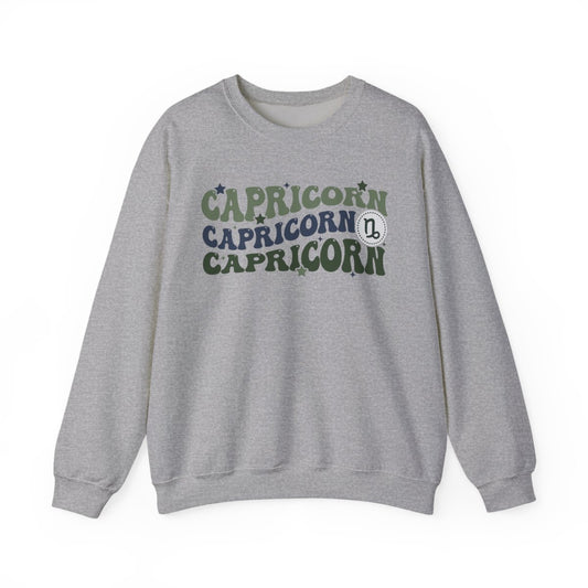 light pink sweatshirt with retro Capricorn zodiac symbol and vintage celestial design