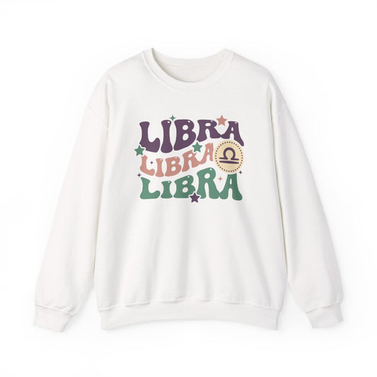 light pink sweatshirt with retro libra zodiac sign design and vintage typography