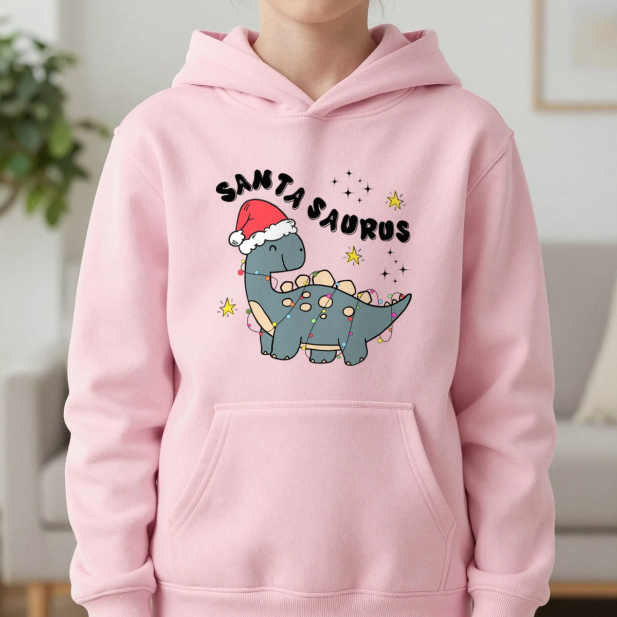Santasaurus Christmas Kids Hoodie in Light Pink, worn, our photo