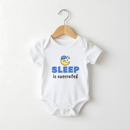 Sleep Is Overrated white baby grow on a hanger