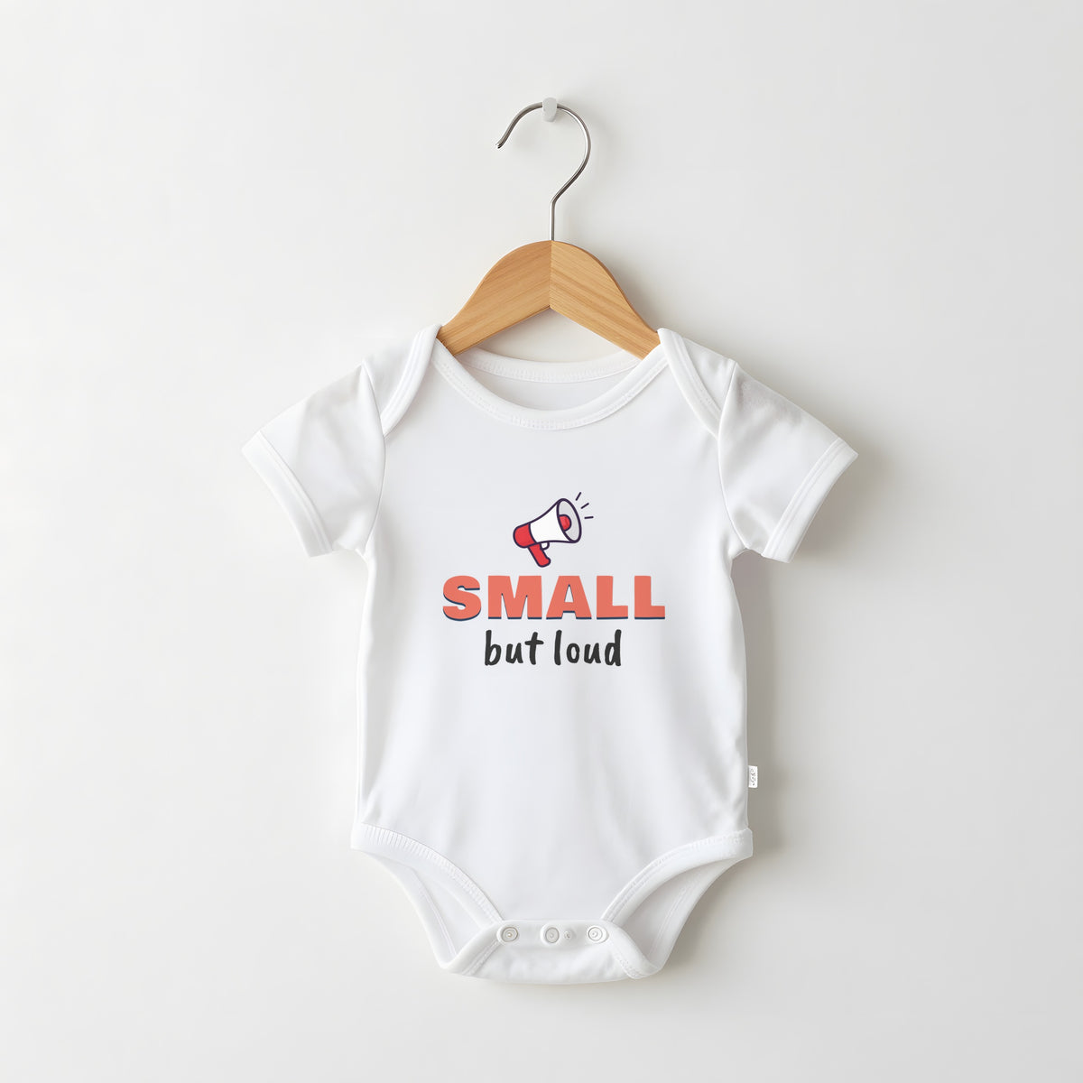 Small But Loud white baby grow on a hanger