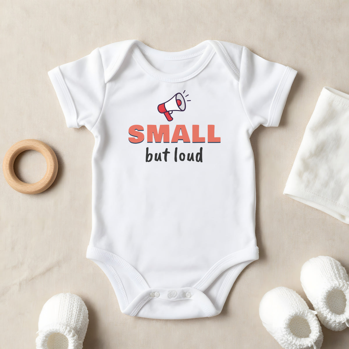 Small But Loud baby grow laid flat