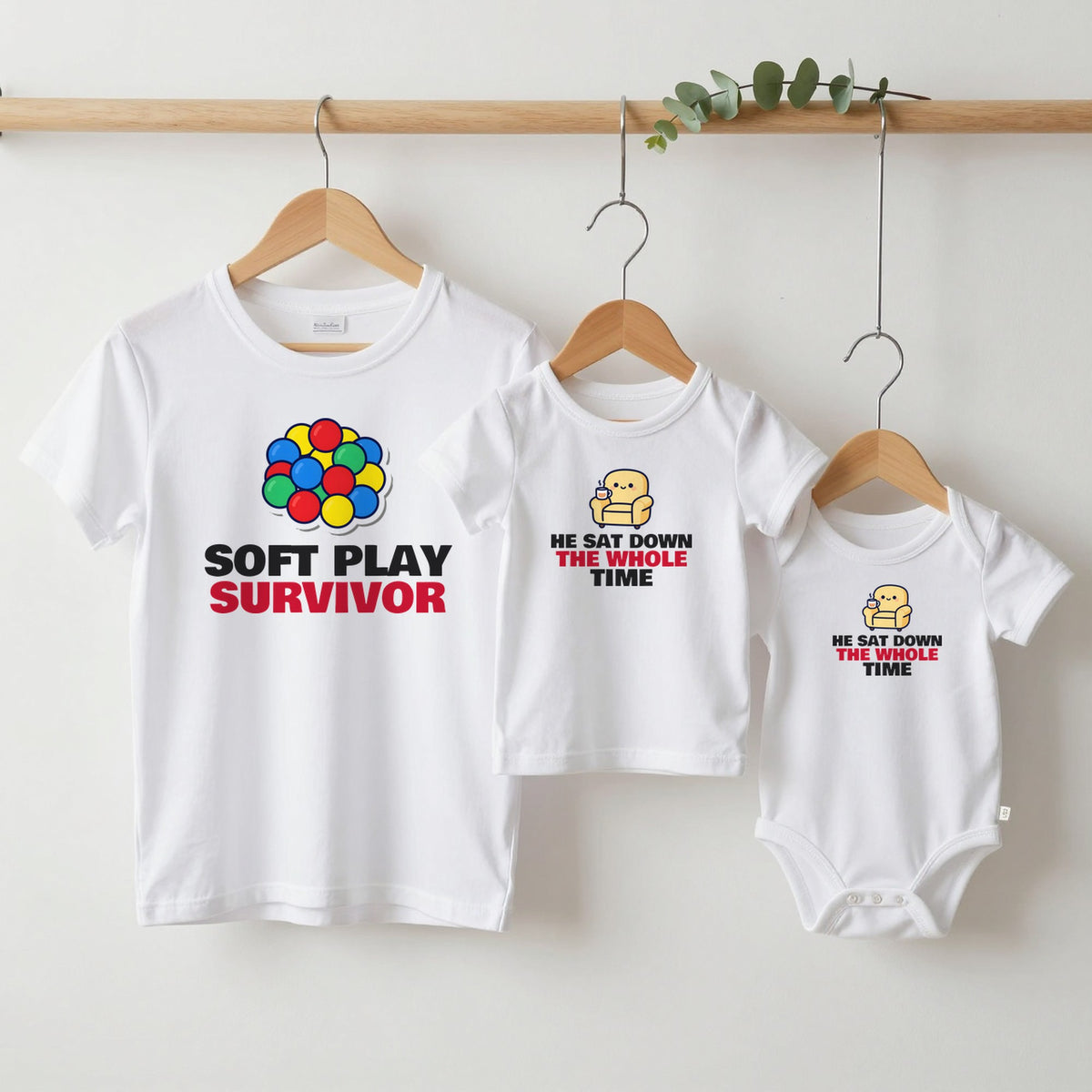 Soft Play Survivor & He Sat Down The Whole Time matching set grown-up tee, kids tee and baby grow on hangers