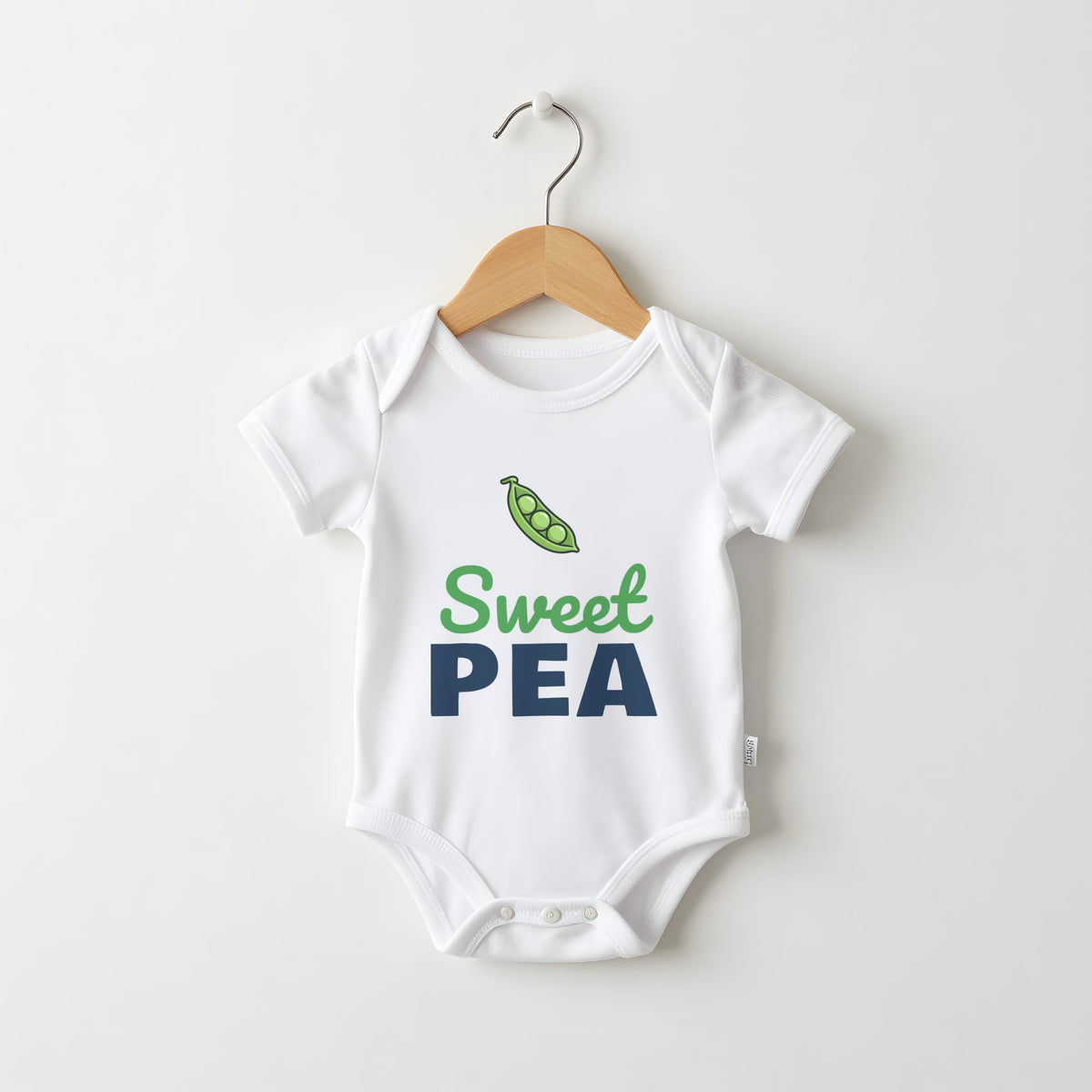 Sweet Pea white baby grow on a hanger