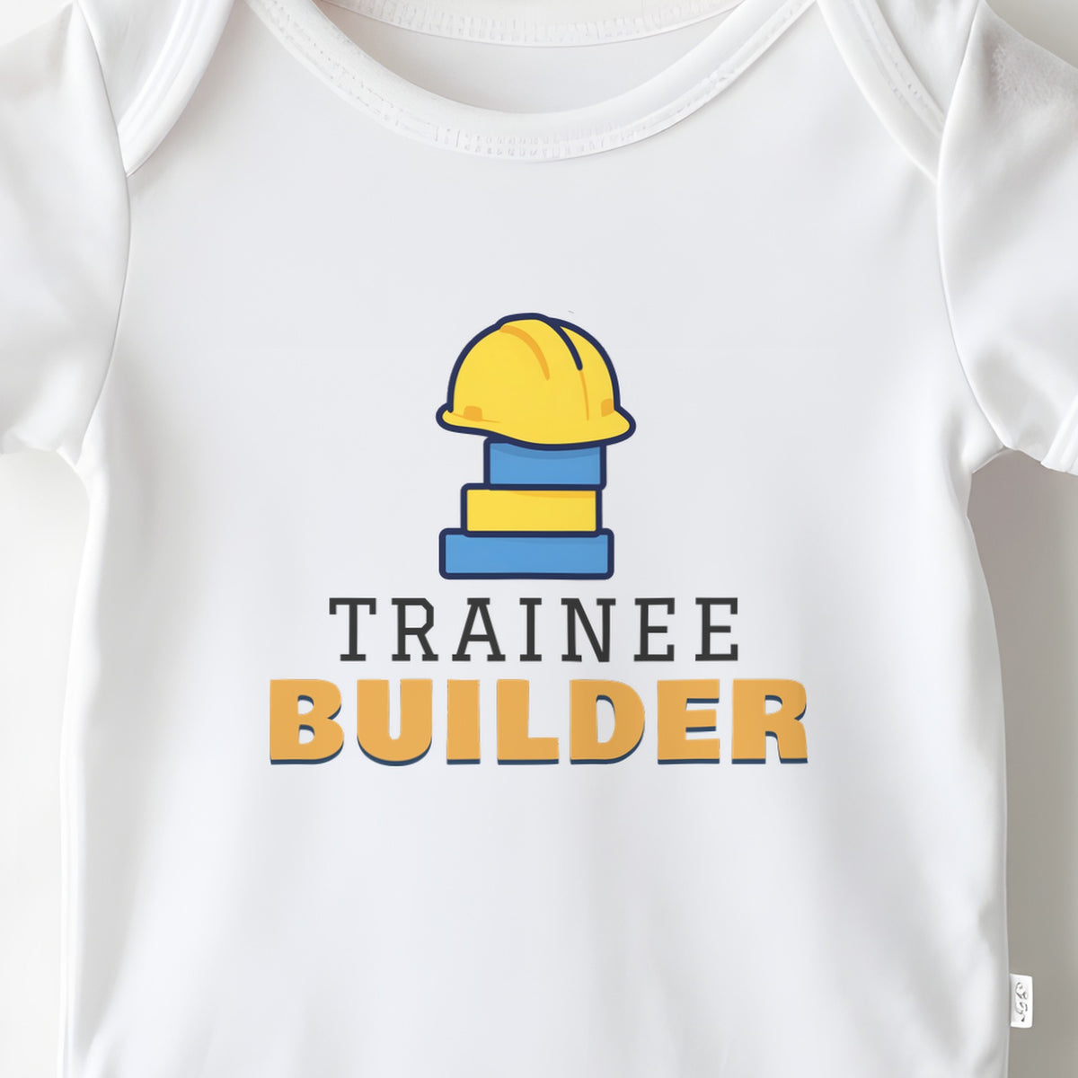 Trainee Builder baby grow print close-up