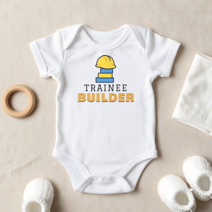 Trainee Builder baby grow laid flat