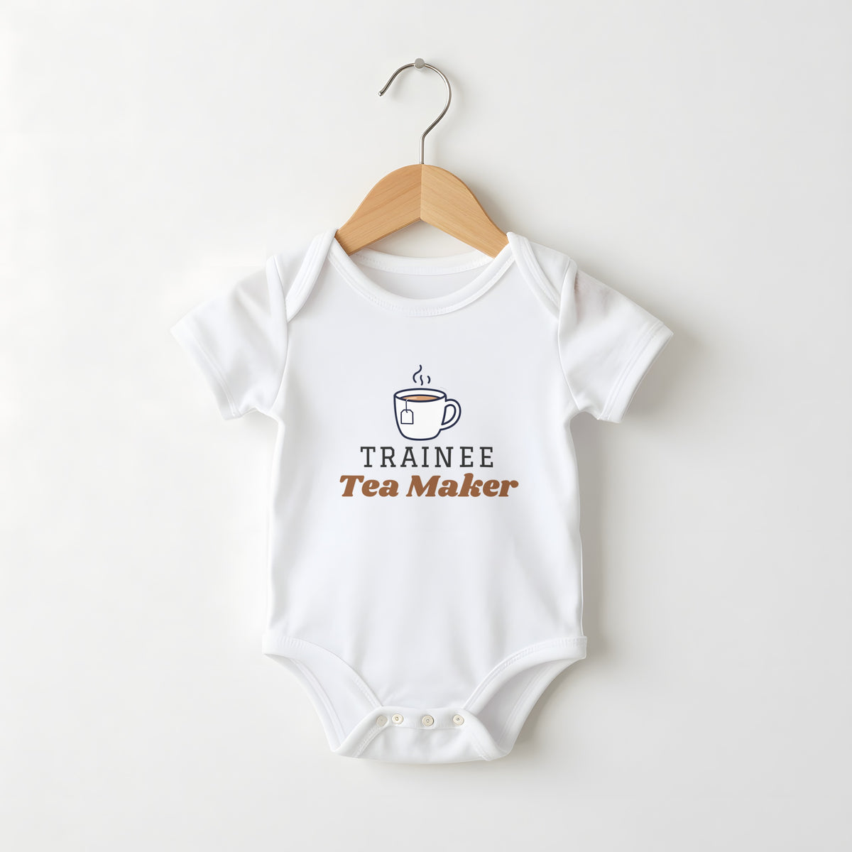 Trainee Tea Maker white baby grow on a hanger