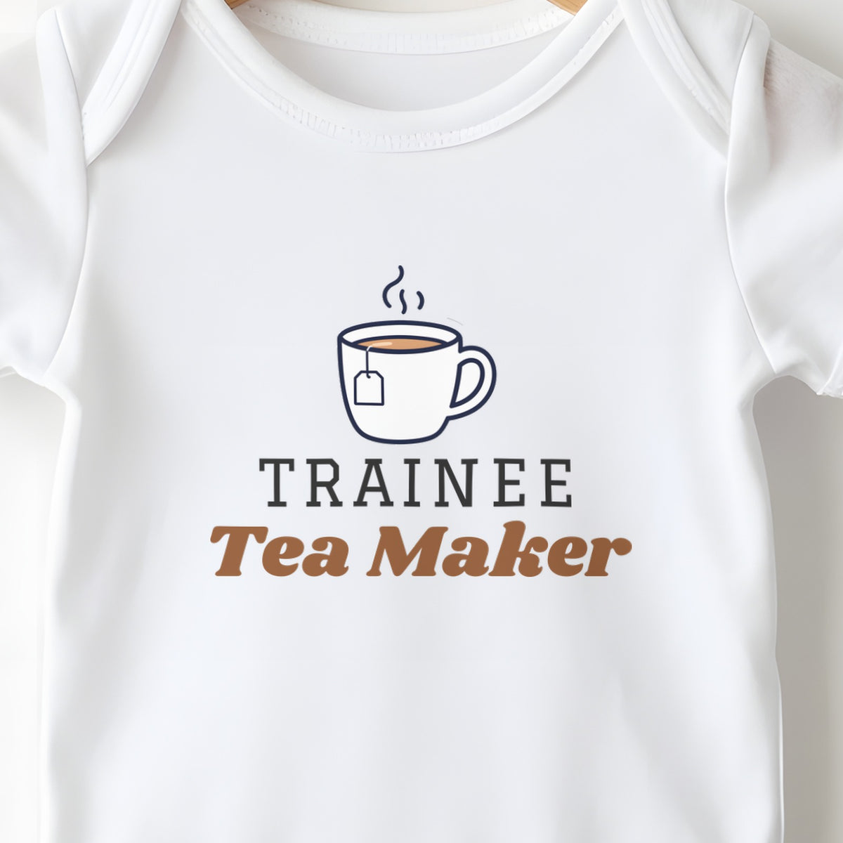 Trainee Tea Maker baby grow print close-up