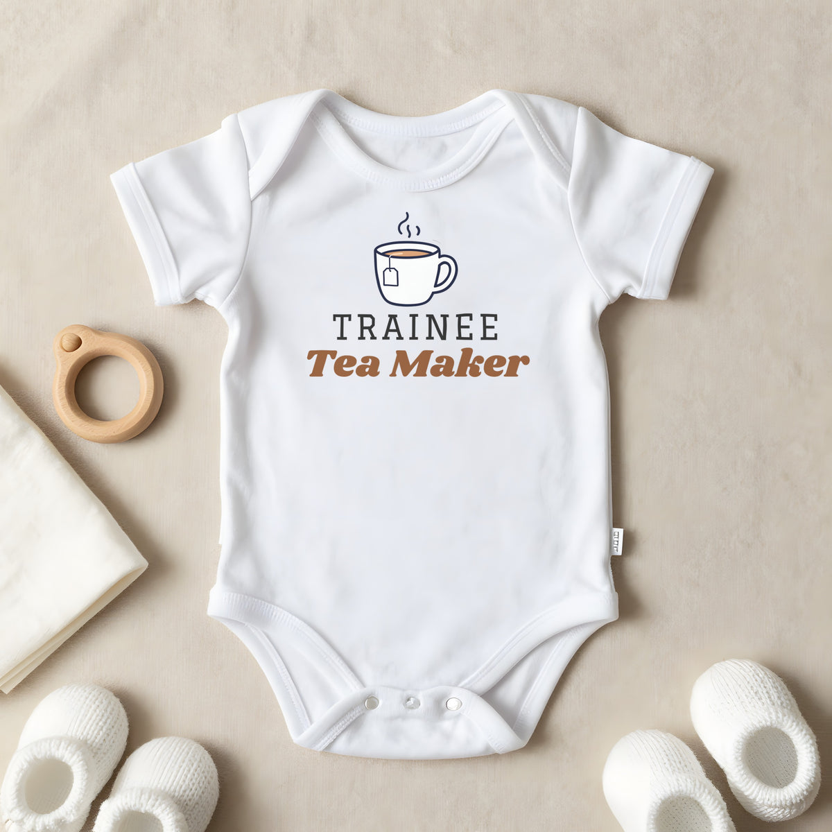 Trainee Tea Maker baby grow laid flat