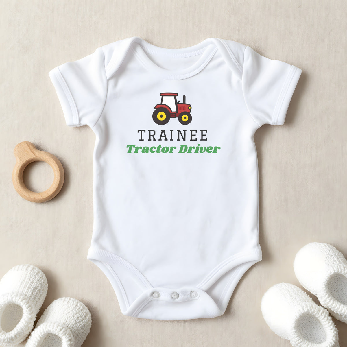 Trainee Tractor Driver baby grow laid flat