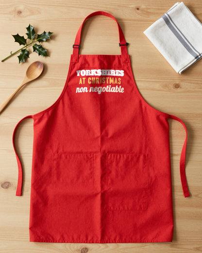Yorkshires At Christmas Non Negotiable Christmas apron laid flat